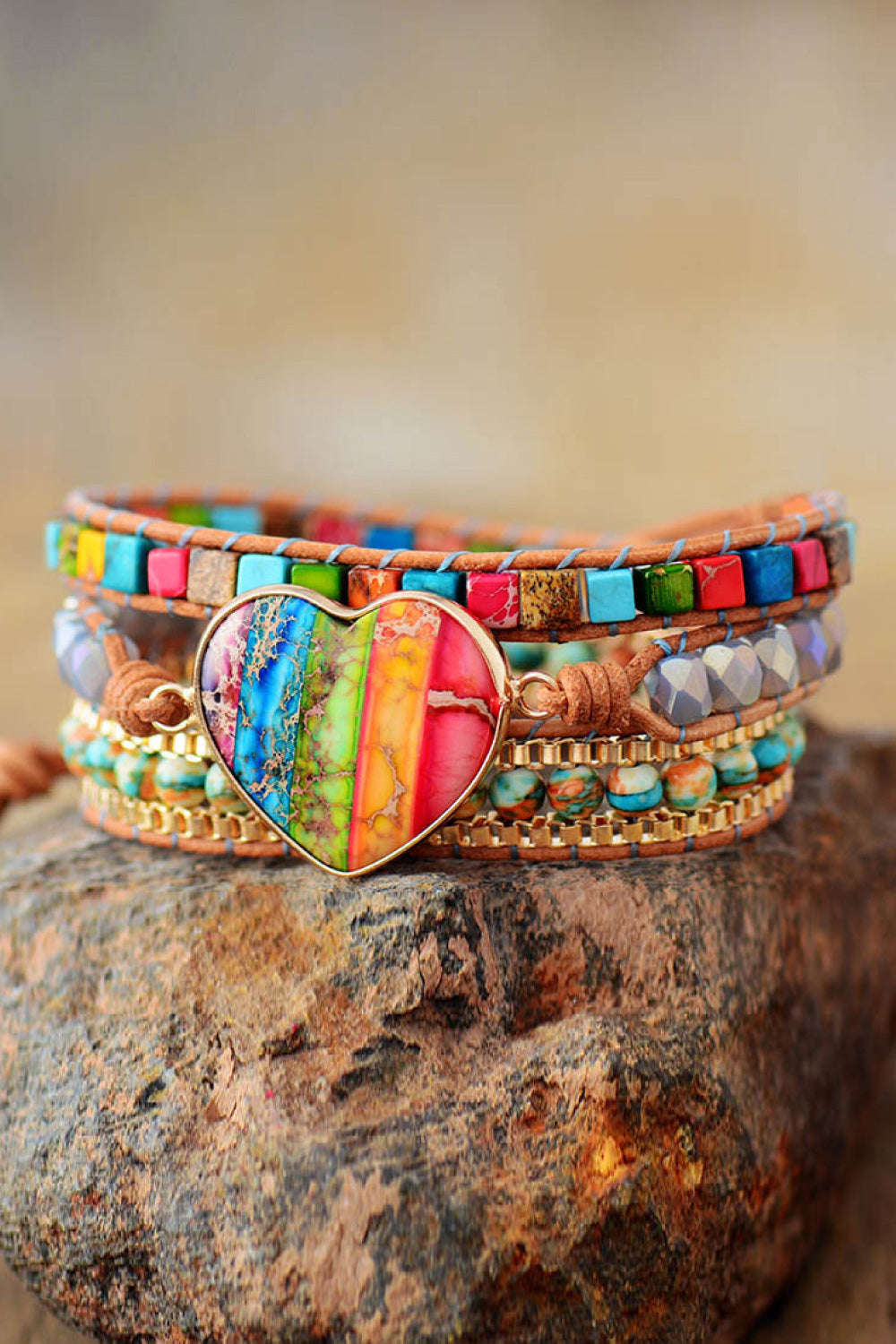 Layered beaded bracelet featuring a heart-shaped rainbow crystal face