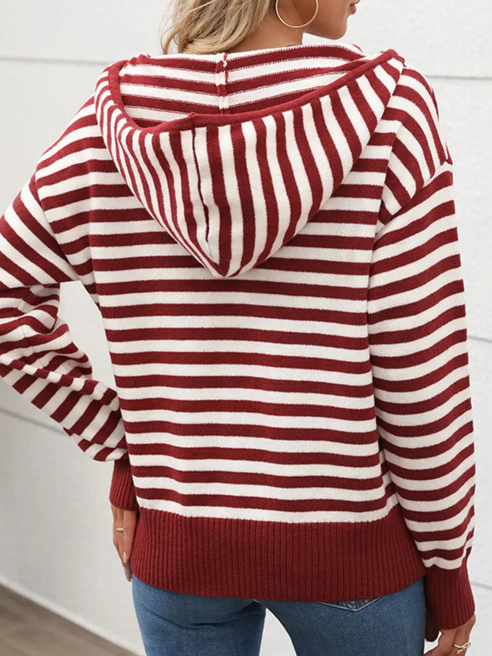 Striped hooded long sleeve sweater in burgundy and white, back view with hood