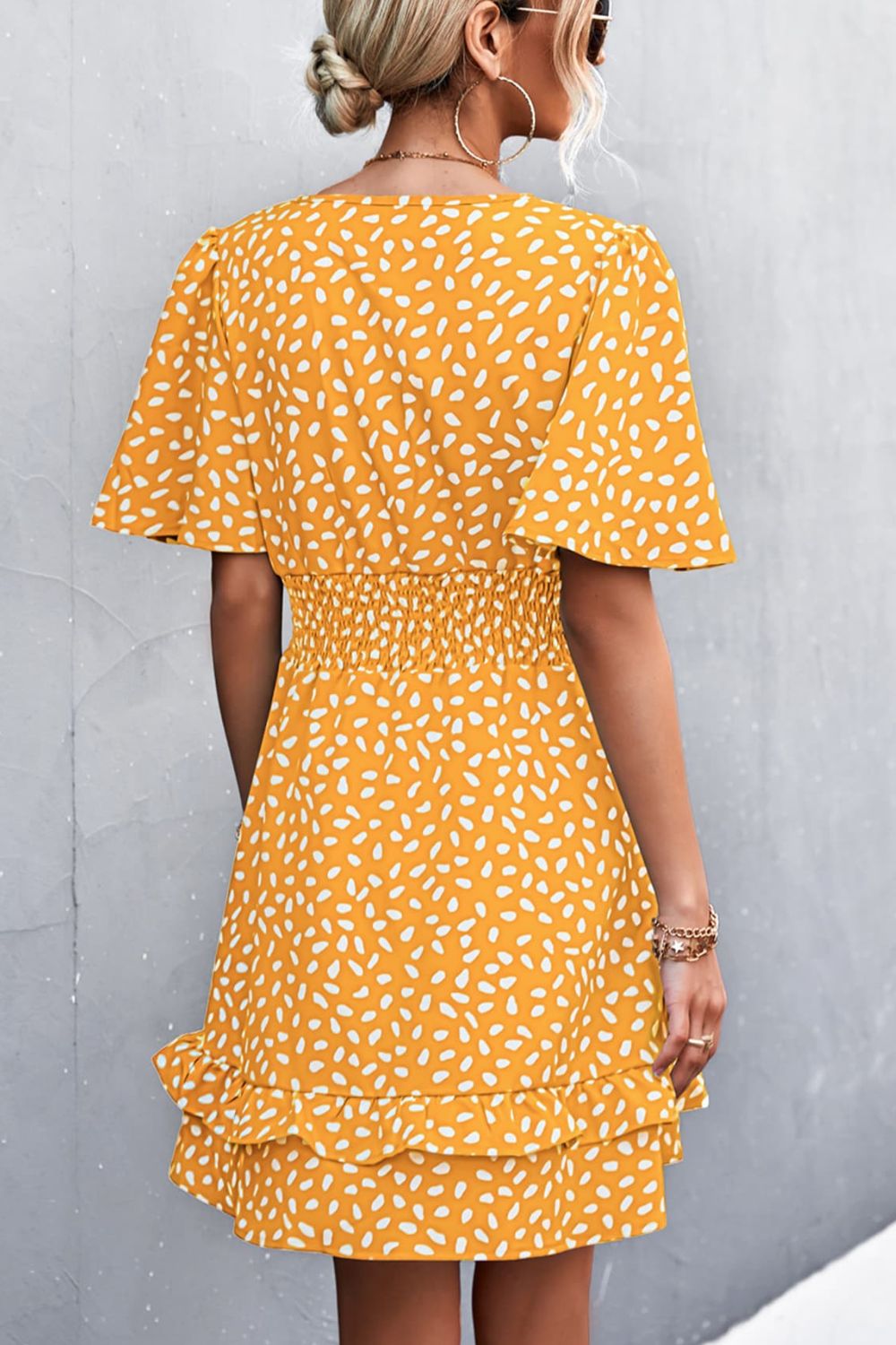 Mustard printed surplice dress with smocked waist and tiered hem, flutter sleeves