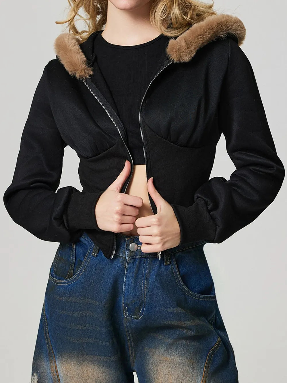 Black fuzzy-trim hooded zip-up jacket with long sleeves and front zipper, side pockets.