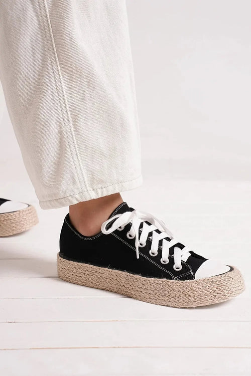 Black lace-up espadrille sole sneakers with white laces on low canvas uppers