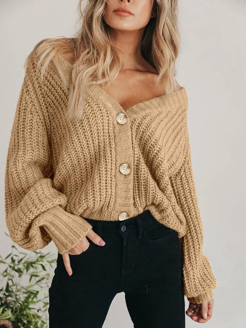 Light tan chunky knit cardigan with long sleeves, V-neck, and button-front closure