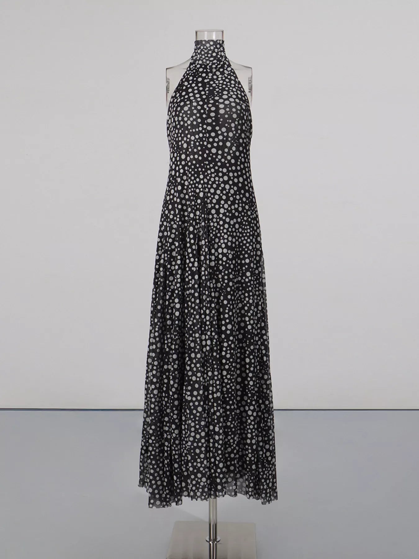 Cedar & Moore Halter Neck Polka Dot Maxi Dress, black with white dots, Trendsi brand, flowy long silhouette.