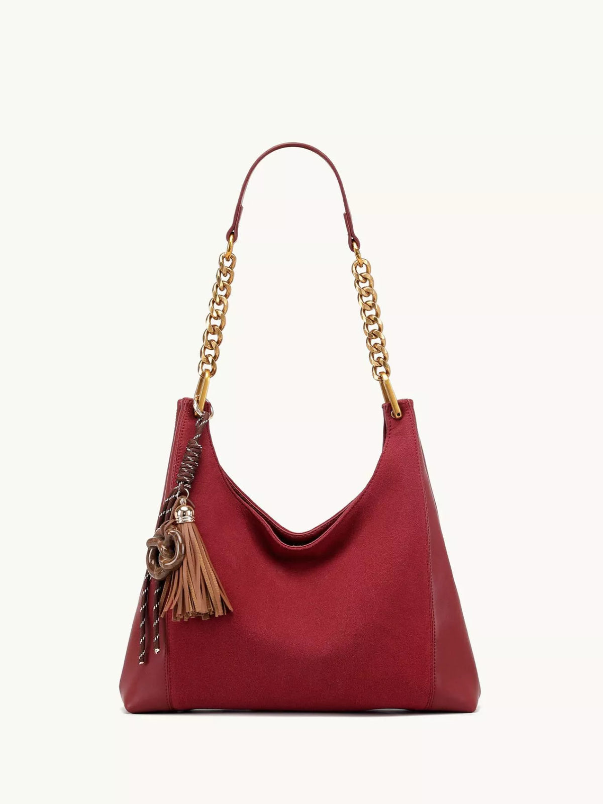 Wine red suede shoulder bag with gold chain strap and tassel, front view.