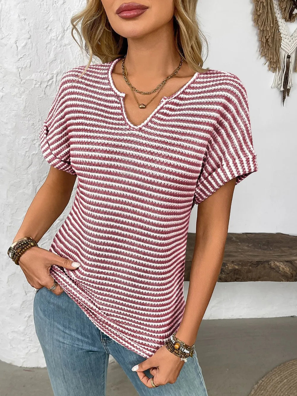 Red and white striped short-sleeve V-neck t-shirt with textured knit and curved hem