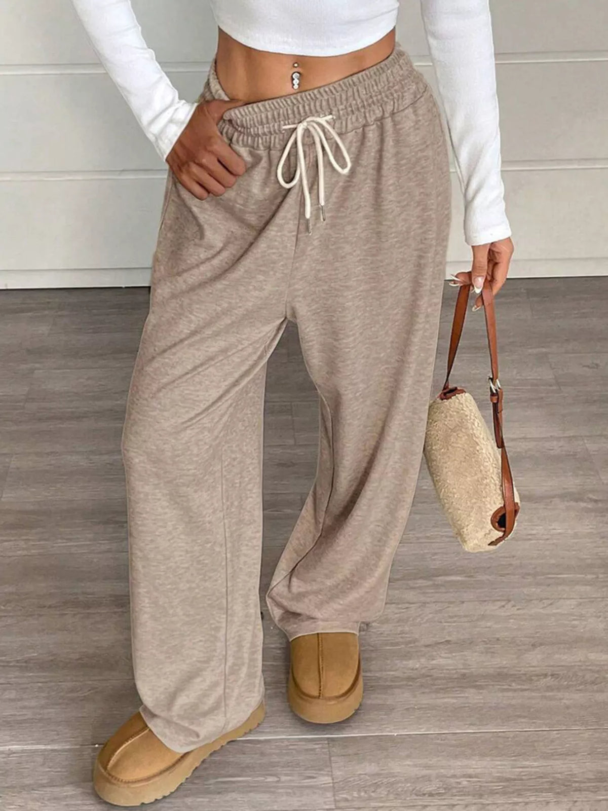 Women's high-waist drawstring wide-leg pants in taupe, with elastic drawstring waist.