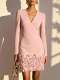 Pale blush V-neck long sleeve mini dress with 3D rose floral hem detail.