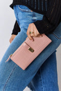 Pink textured PU leather wallet with gold-tone clasp and croc-embossed panel.