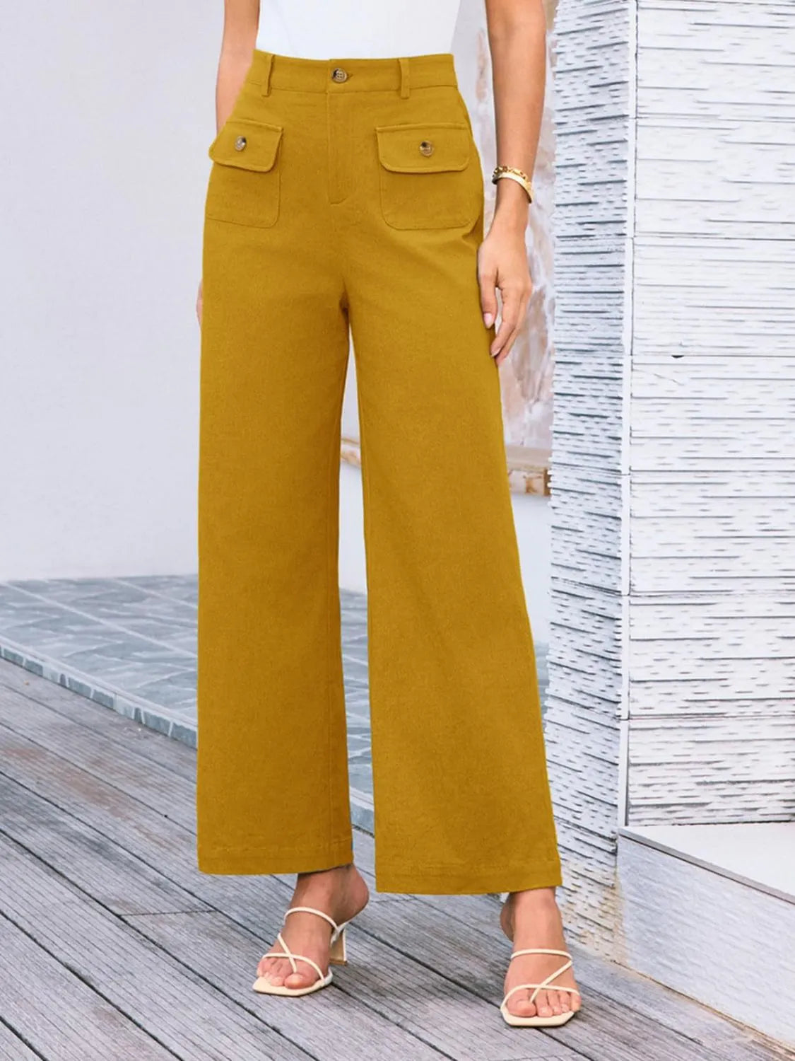High waist wide leg pants in mustard yellow with front button and two flap pockets