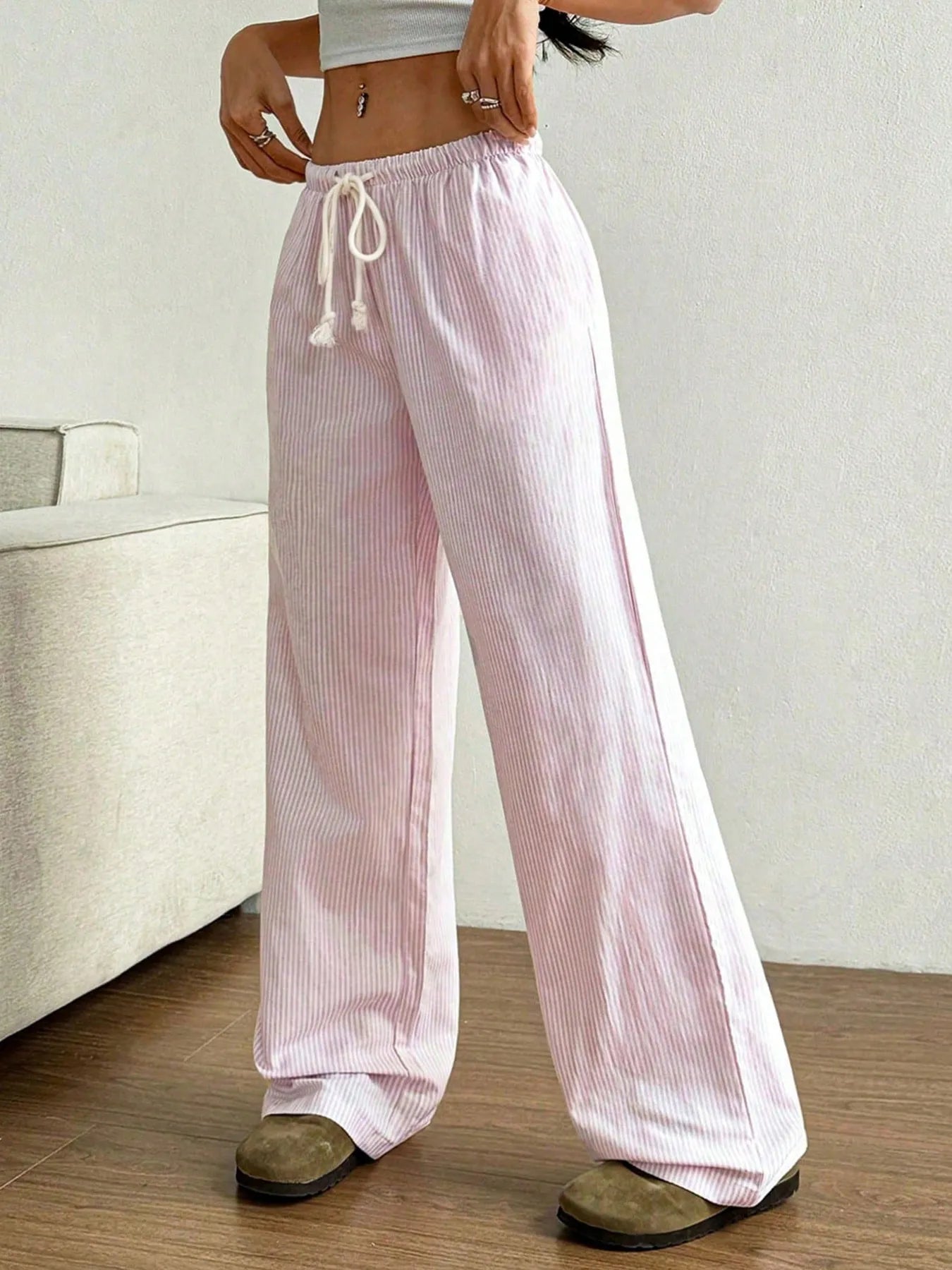 Light pink striped wide-leg pants with elastic waistband and white drawstring ties
