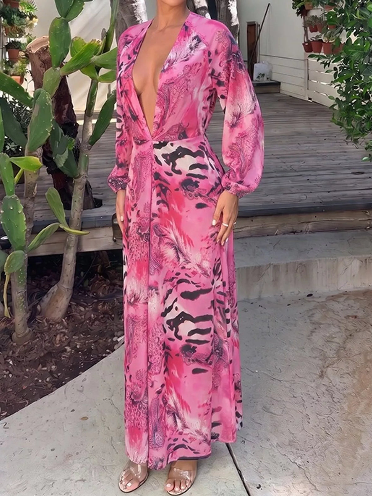 Pink printed flowy maxi dress with deep V neckline, long blouson sleeves, side slit