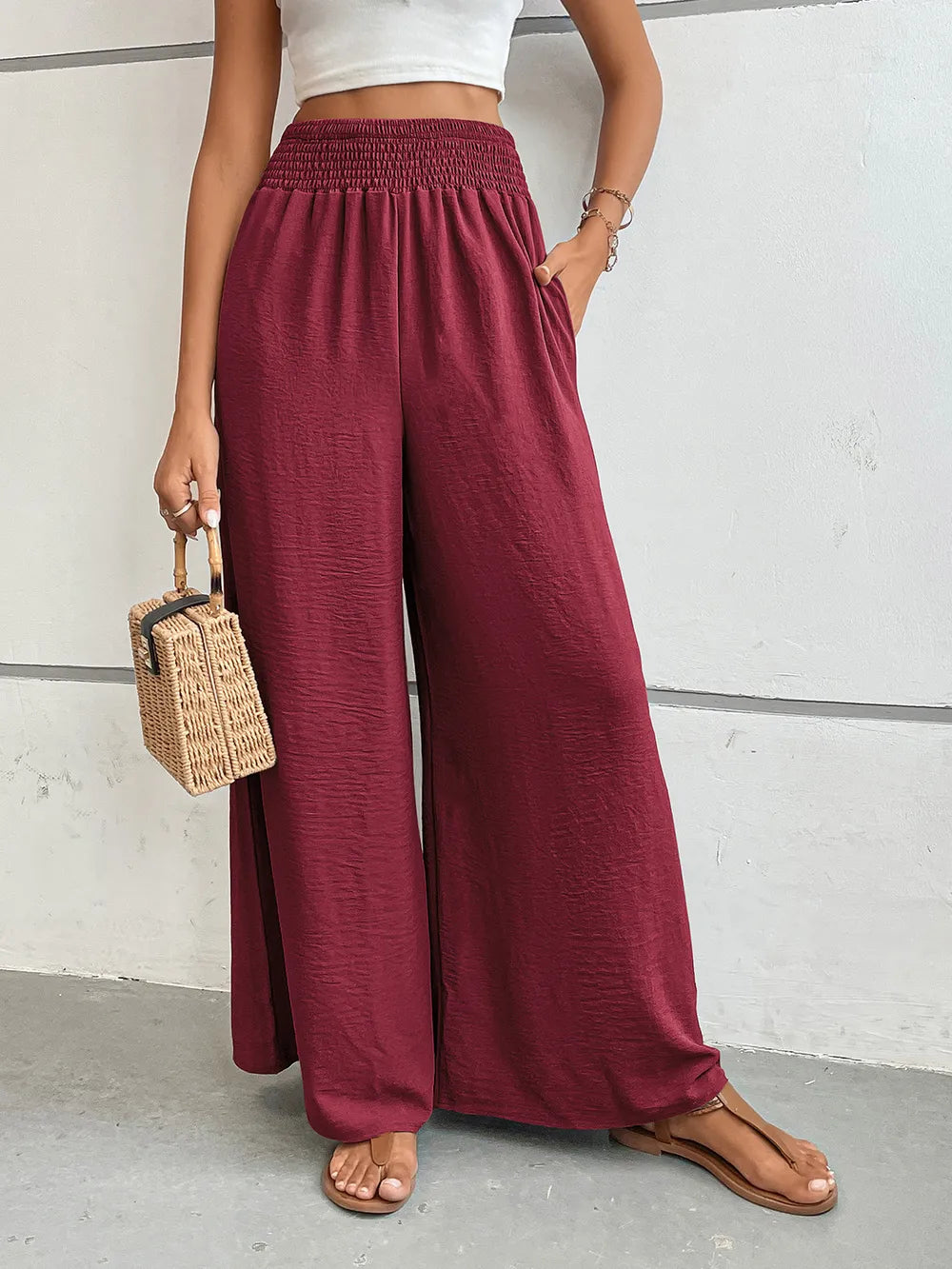 Wide-leg pants in burgundy with elastic waist and side pockets