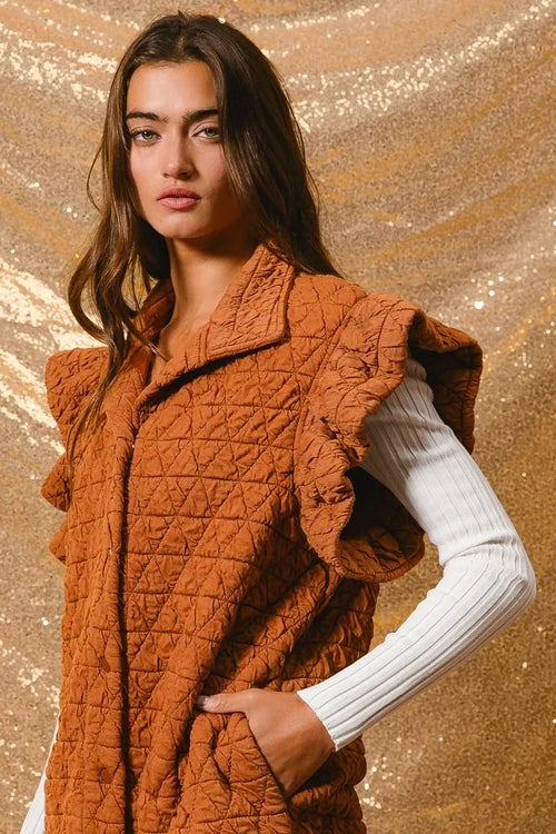 Rust quilted knit vest with ruffle sleeves and button front