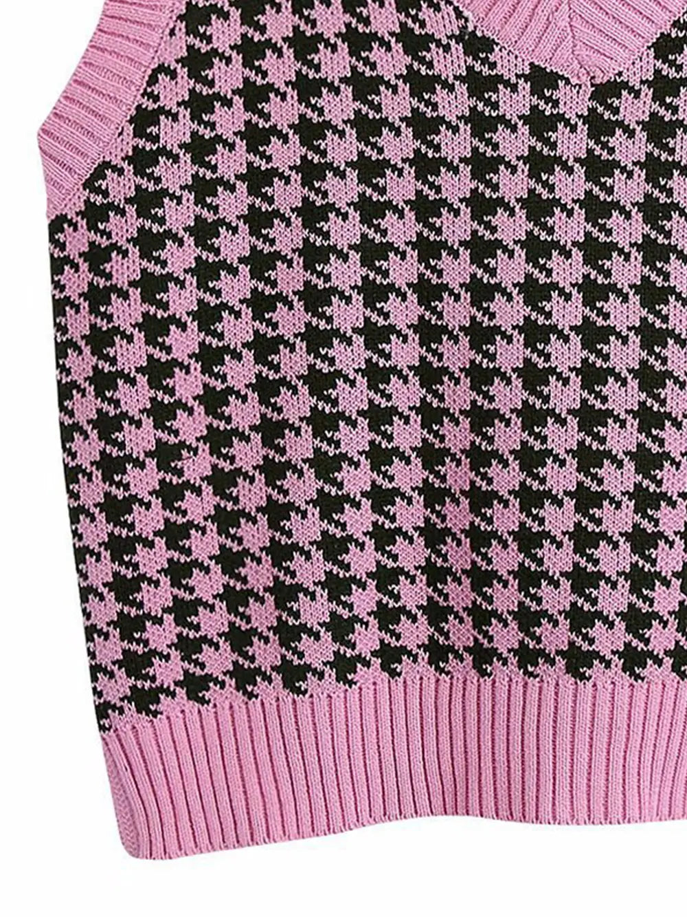 Pink-and-black houndstooth sweater vest knit with ribbed hem