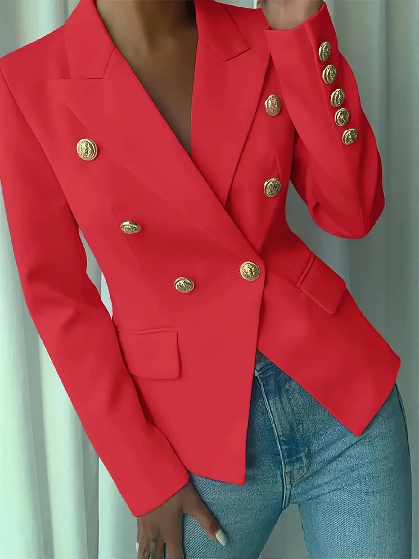 Red blazer with notch lapel, gold decorative buttons, and flap chest pocket