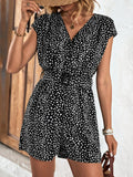 Black and white animal print belted romper with V-neck and short sleeves