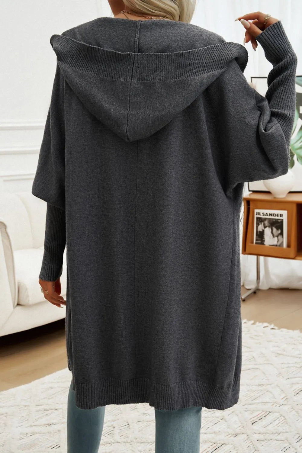 Dark gray hooded long cardigan shown from back with oversized hood.