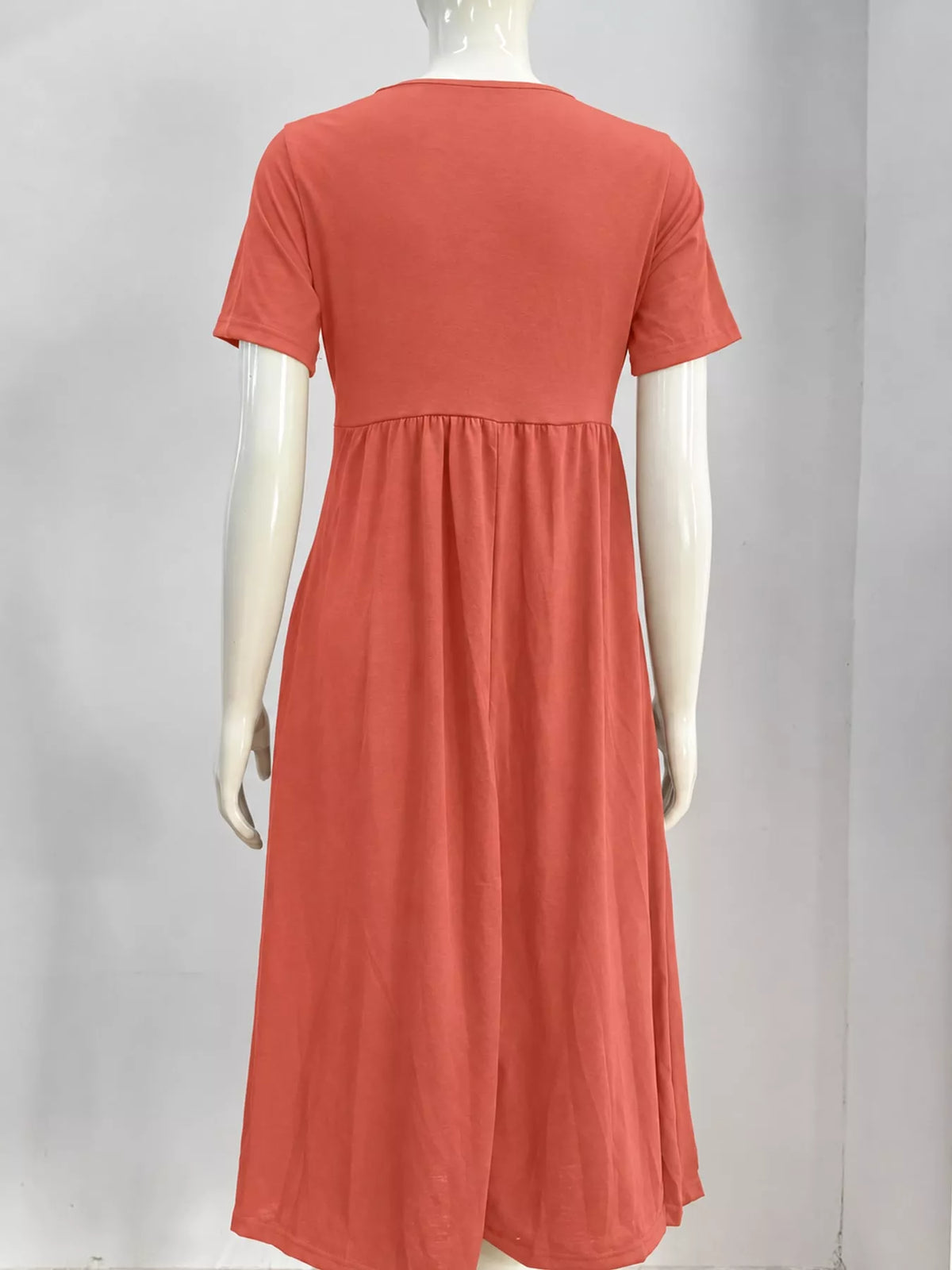 Coral crisscross high-waist midi dress on a mannequin, back view