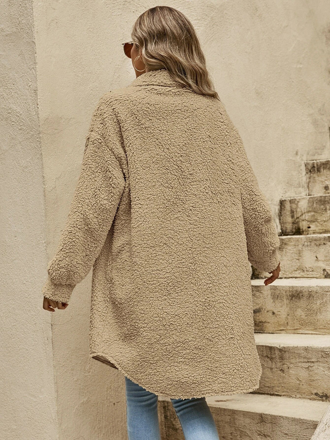 Tan collared button-down sherpa coat, button front and long sleeves, rear view