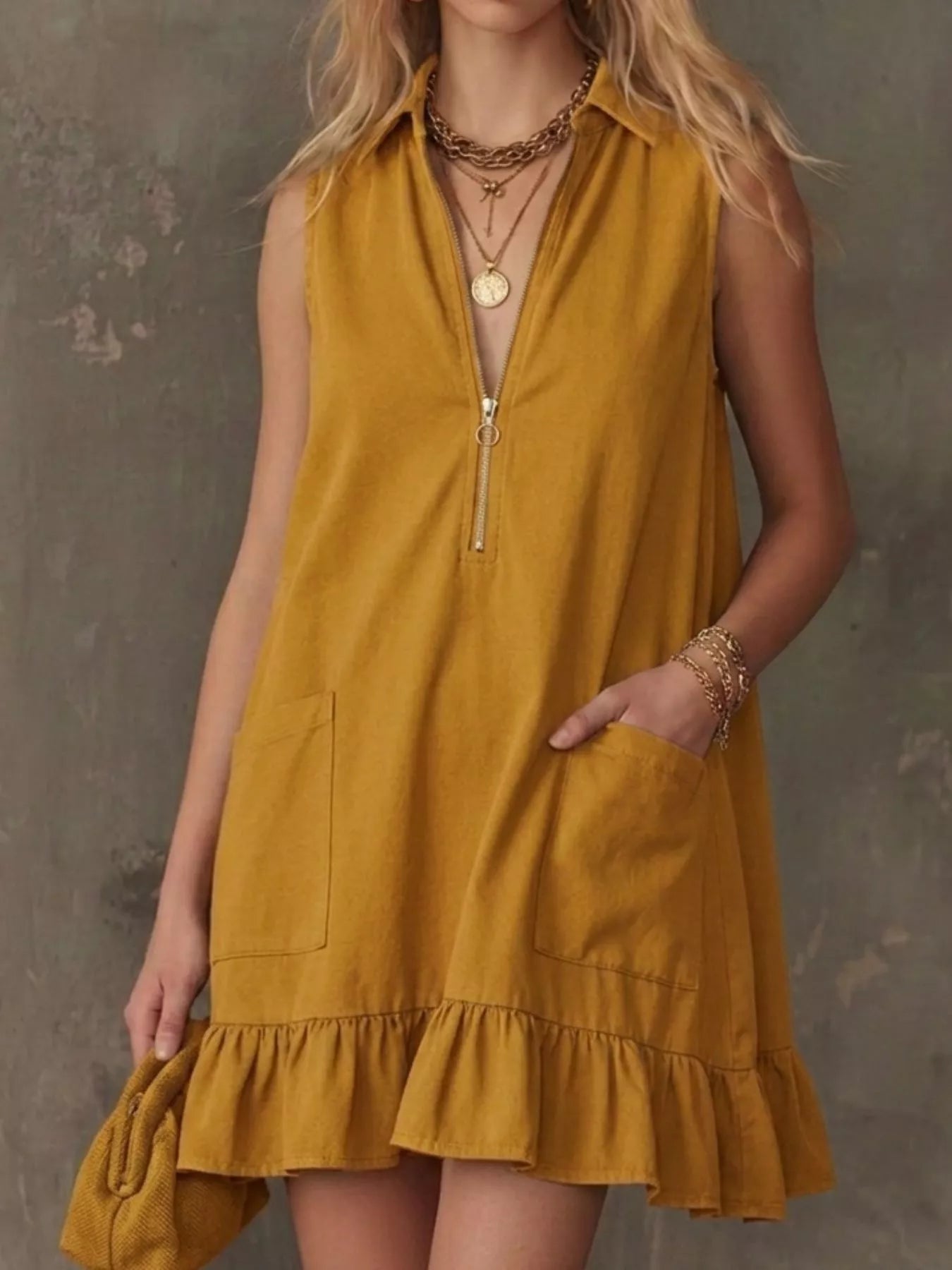 Mustard sleeveless collared zip-front ruffle hem dress with front zip and pockets