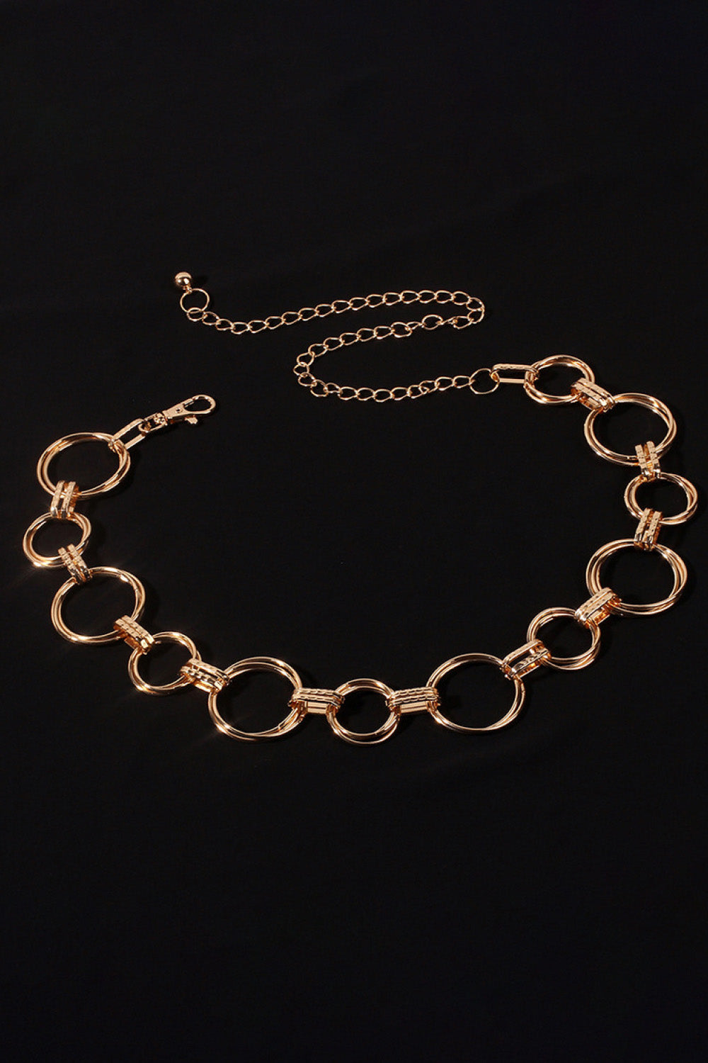 Gold alloy chain belt with round link rings and a short extender chain