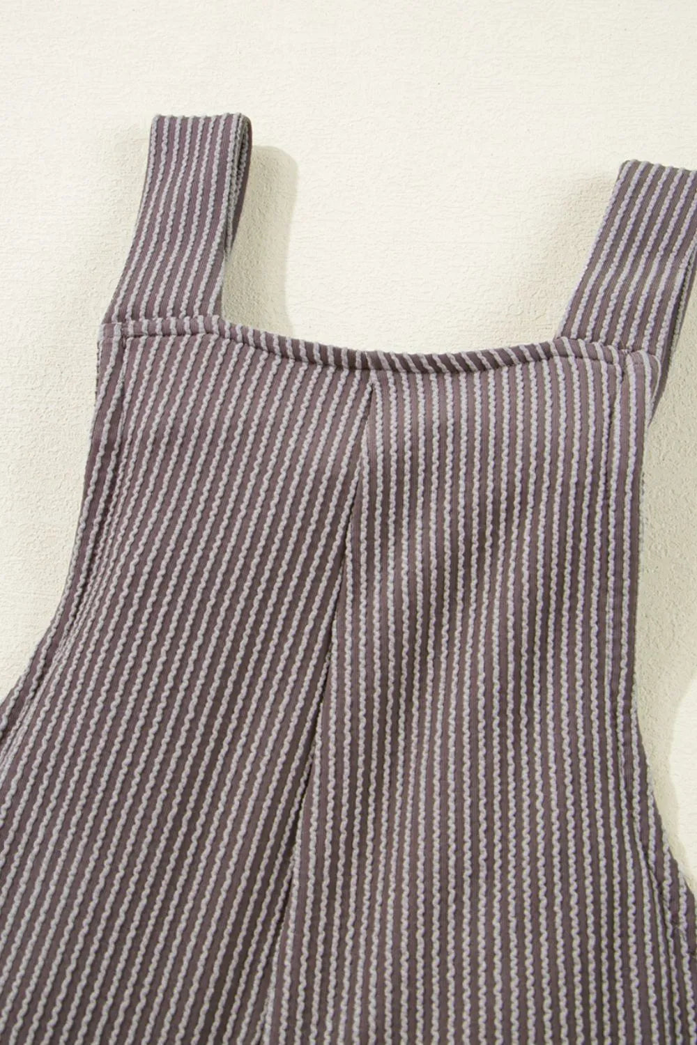 Striped overalls with square neckline, adjustable straps, front seam details