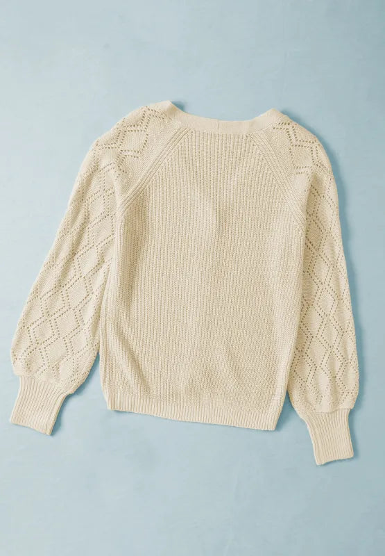 Cream openwork knit V-neck button-up cardigan with long sleeves, back view