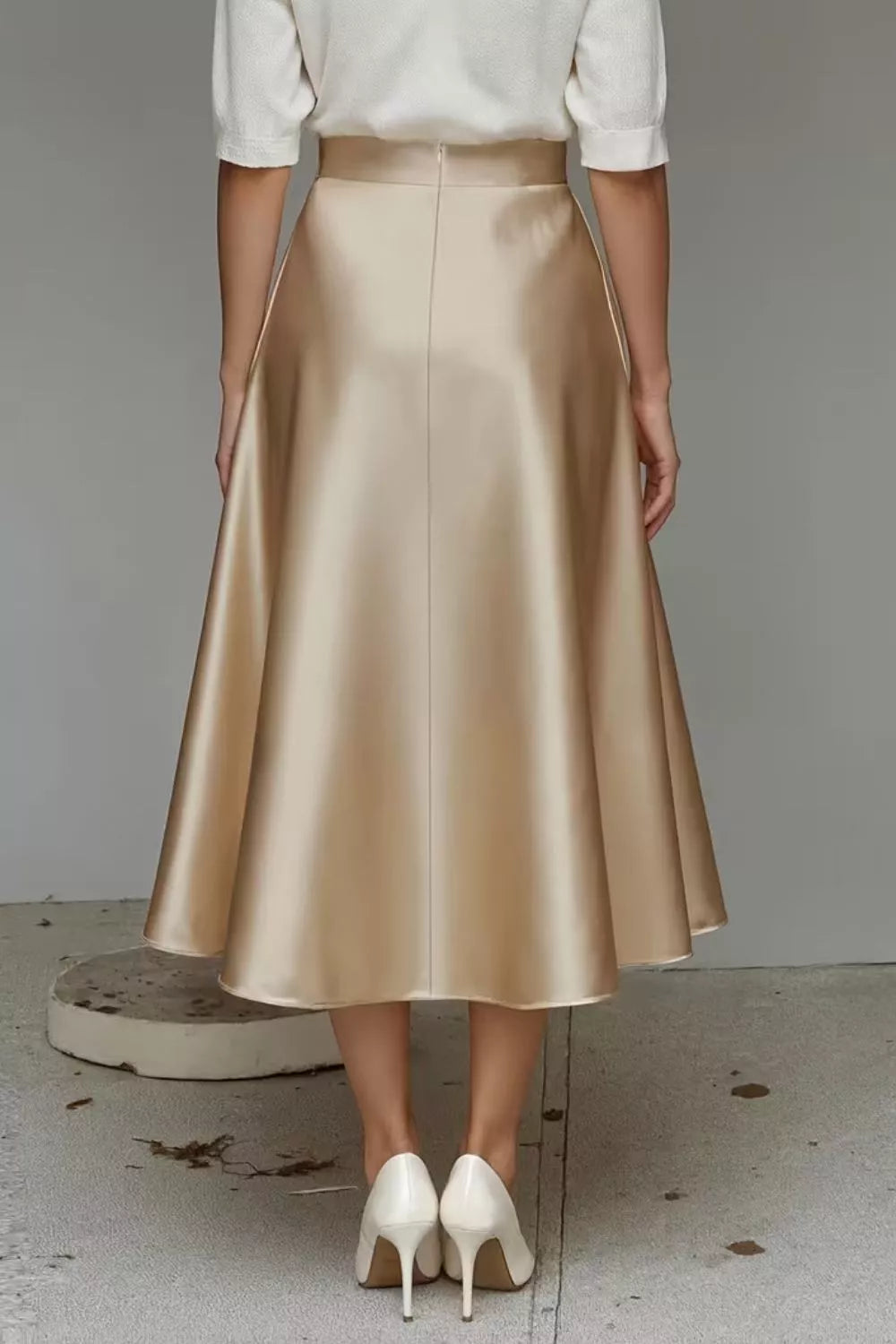 Satin A-line midi skirt in light gold with waist seam and side pockets