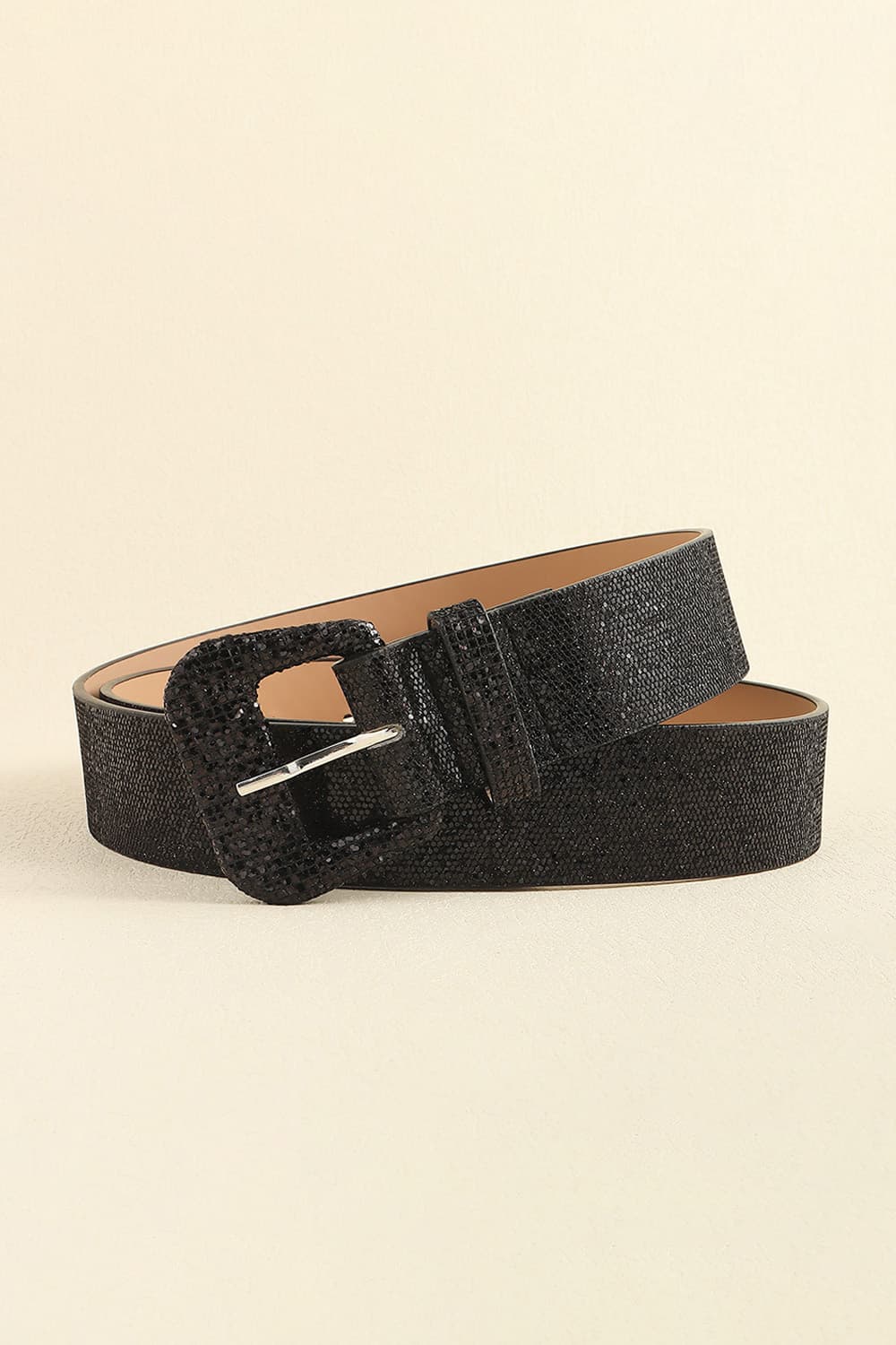 Black glitter vegan leather belt with silver-tone buckle, flat lay