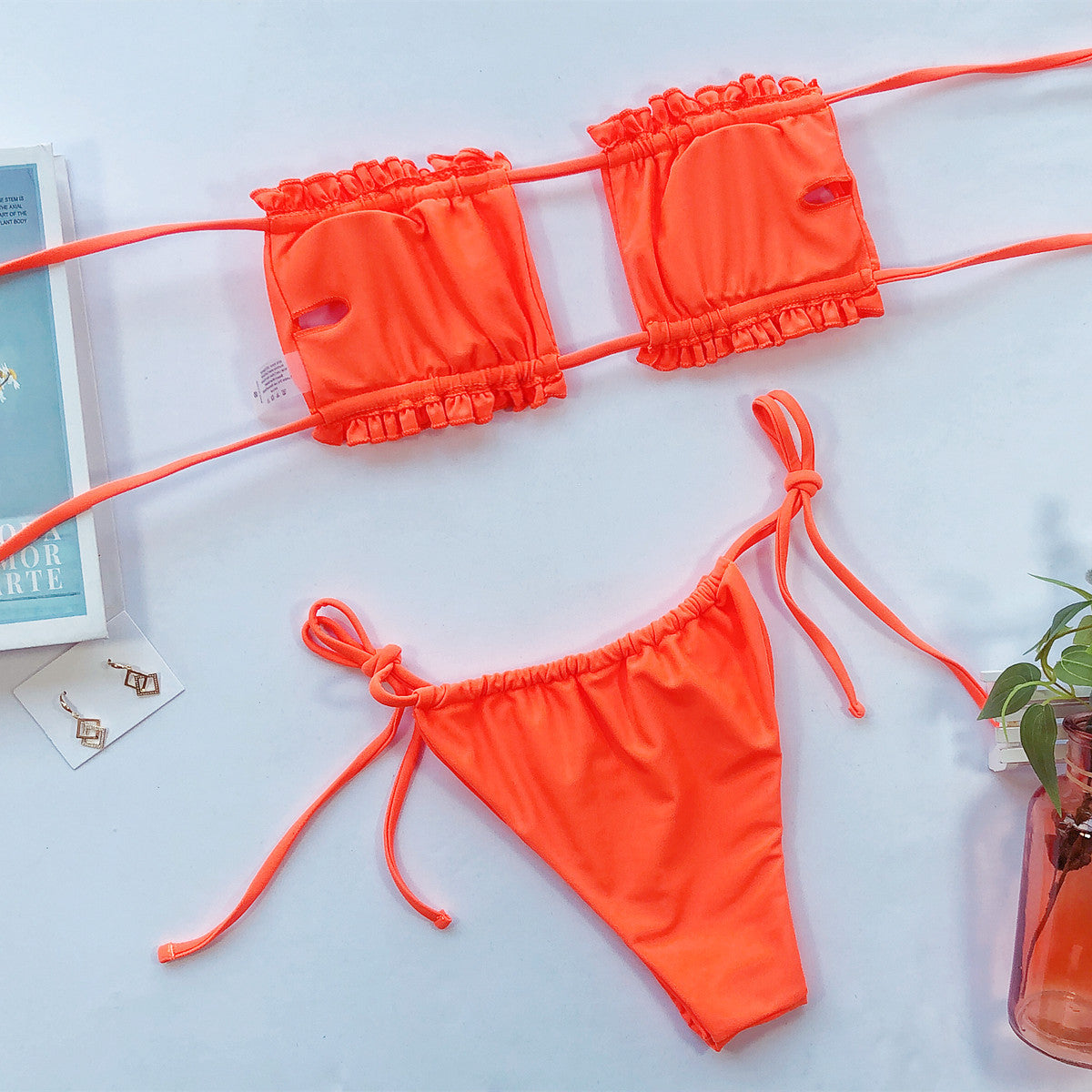 Bright orange ruched bandeau bikini top and string side-tie bikini bottom set