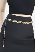 Gold lobster clasp belt with ornate oval-link chain trim across the waist