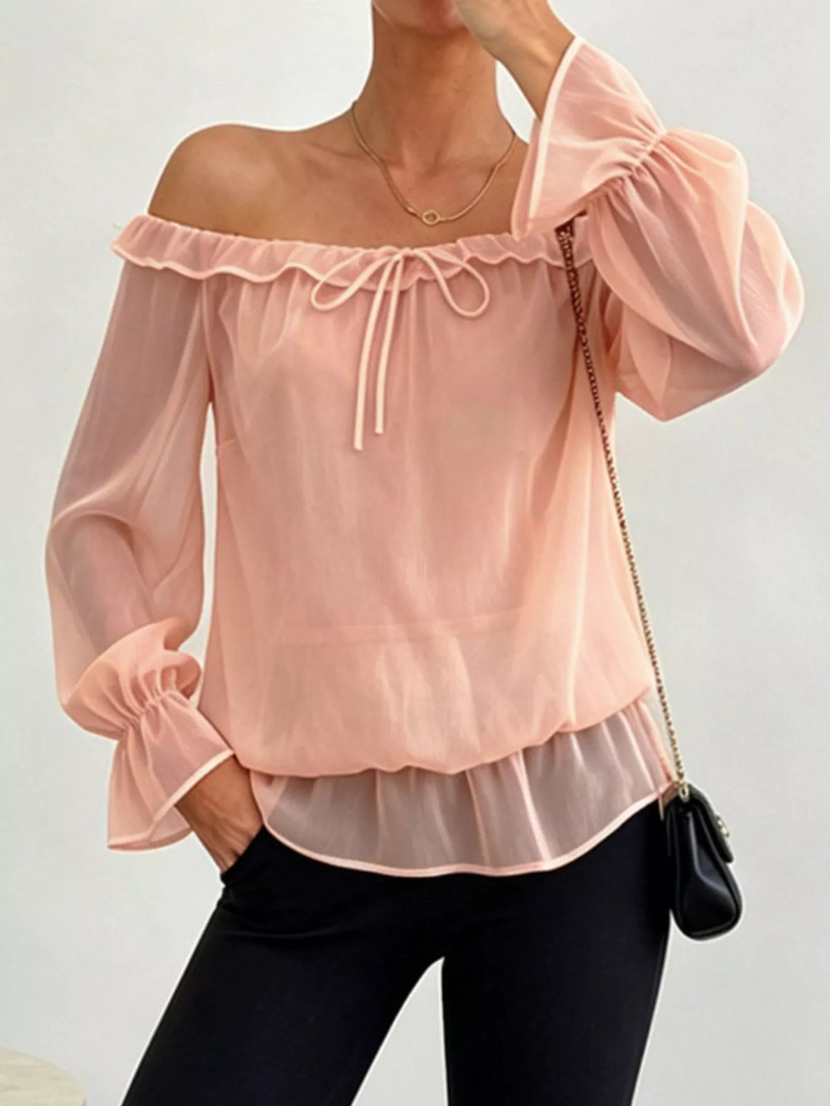 Peach off-shoulder chiffon peplum blouse with ruffle trim and long puff sleeves