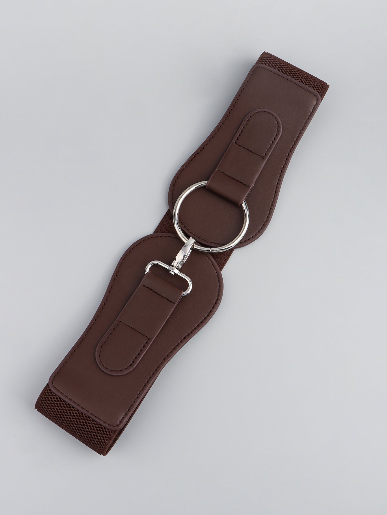 Caramel brown elastic vegan leather belt with two D-ring attachments and buckle clasp