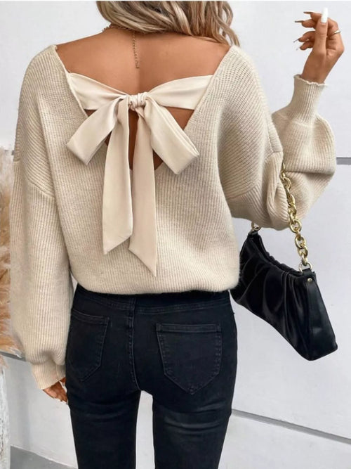 Light beige back-bow V-neck sweater with tie detail at upper back