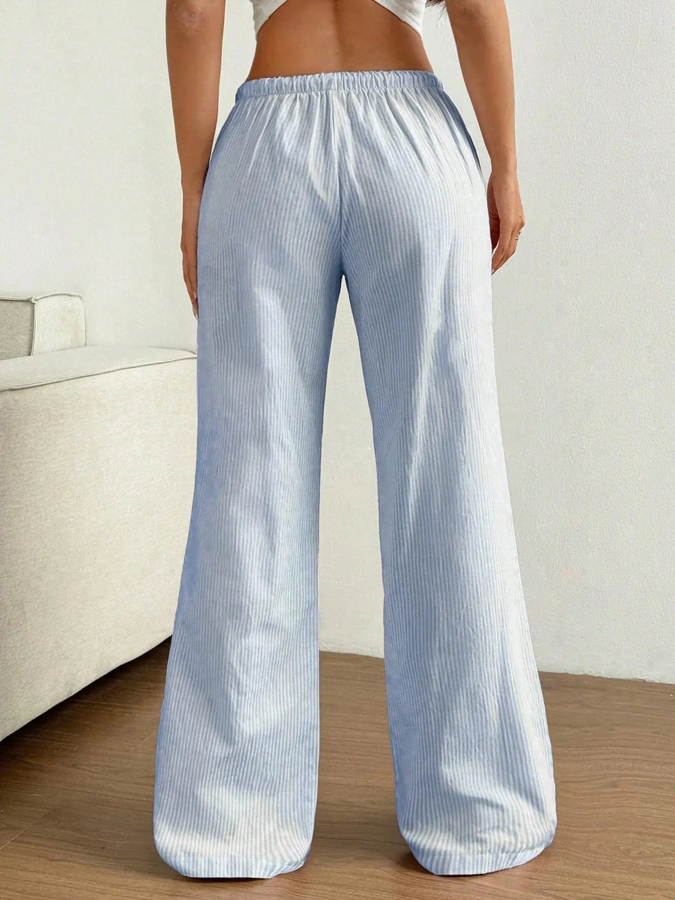 Light blue striped wide-leg pants with elastic drawstring waist and relaxed fit