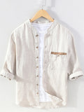 Light khaki button-up shirt, 3/4 sleeves, button front, stand collar, chest pocket