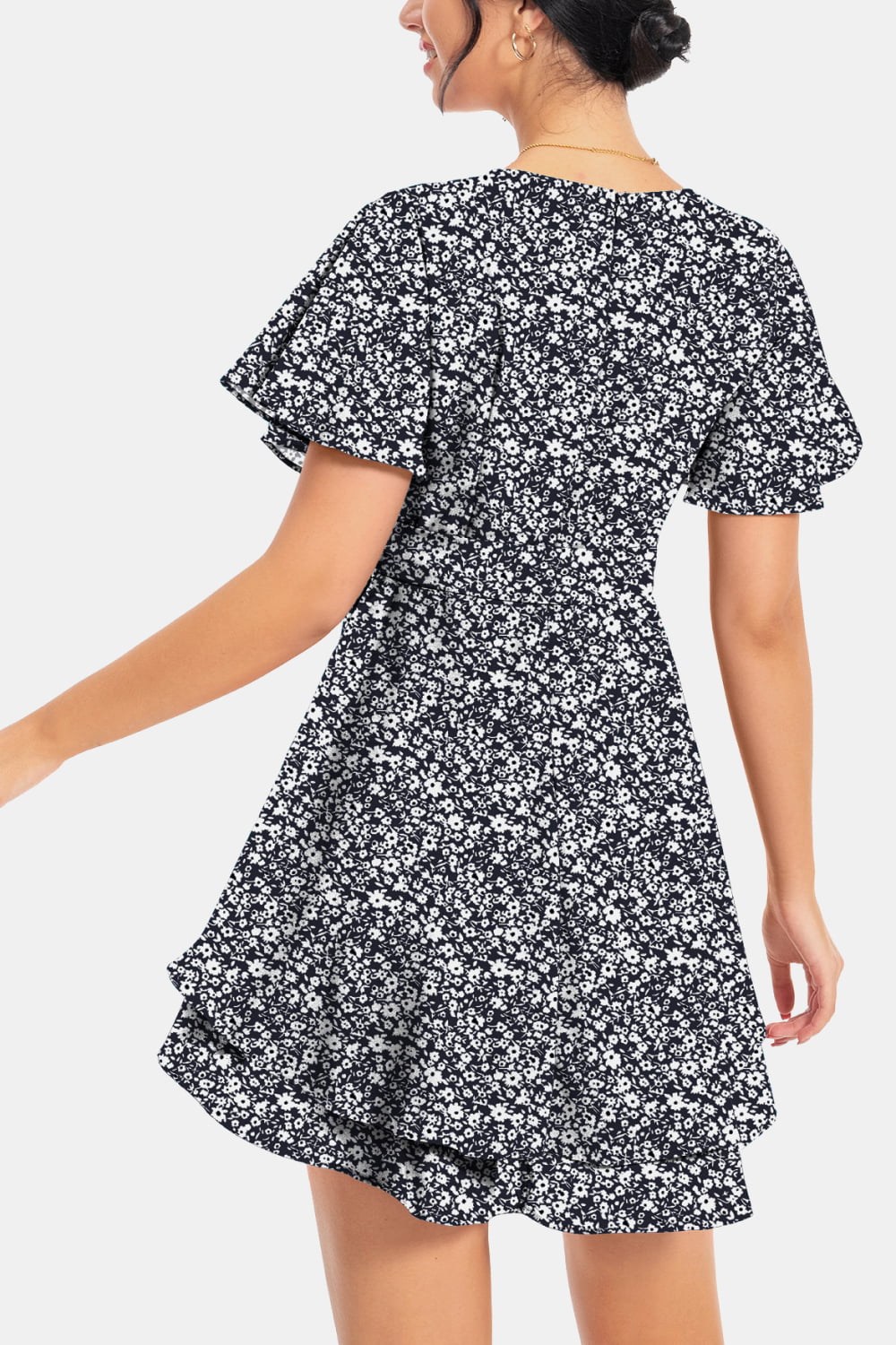 Black-and-white floral surplice mini dress, back view with flutter sleeves