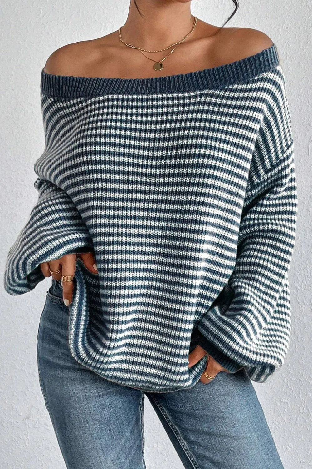 Blue and white striped boat-neck sweater with batwing sleeves and ribbed neckline