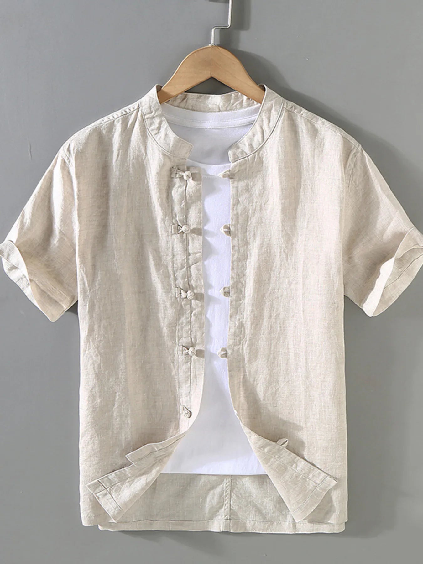 Cream button-up short-sleeve shirt with band collar and button front