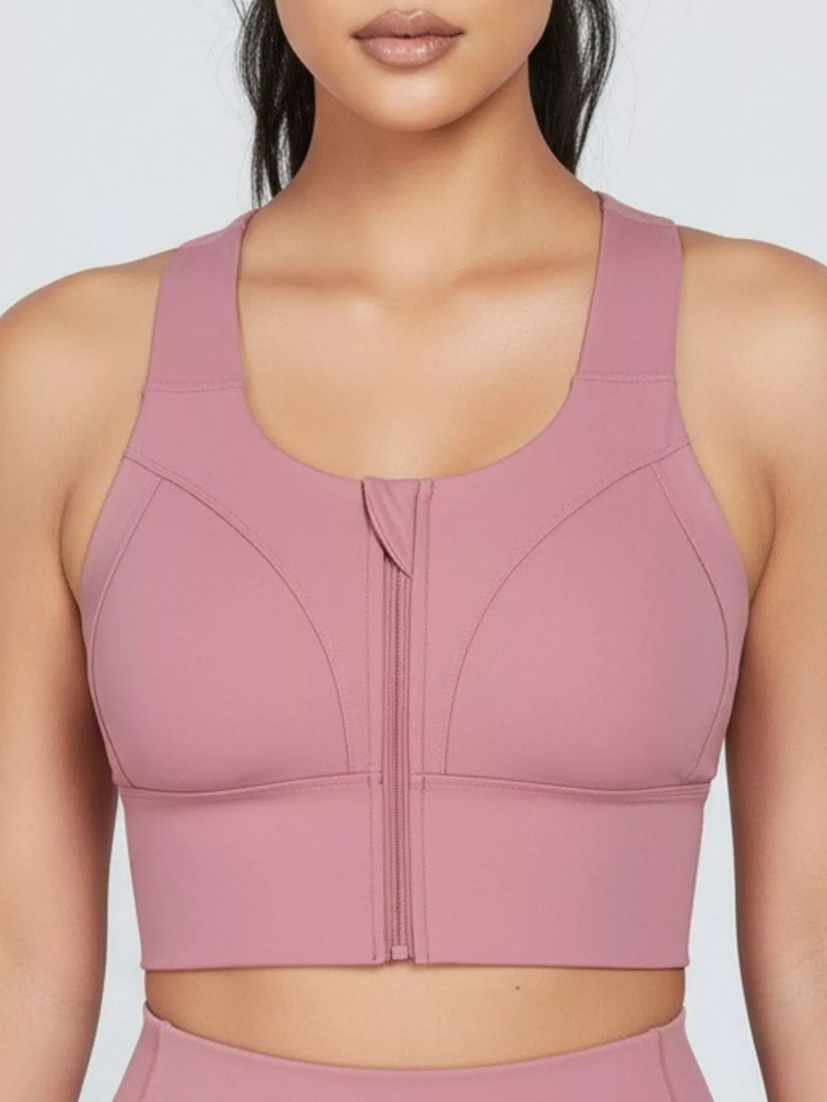 Pink seamless active tank top with front zipper and structured padded look