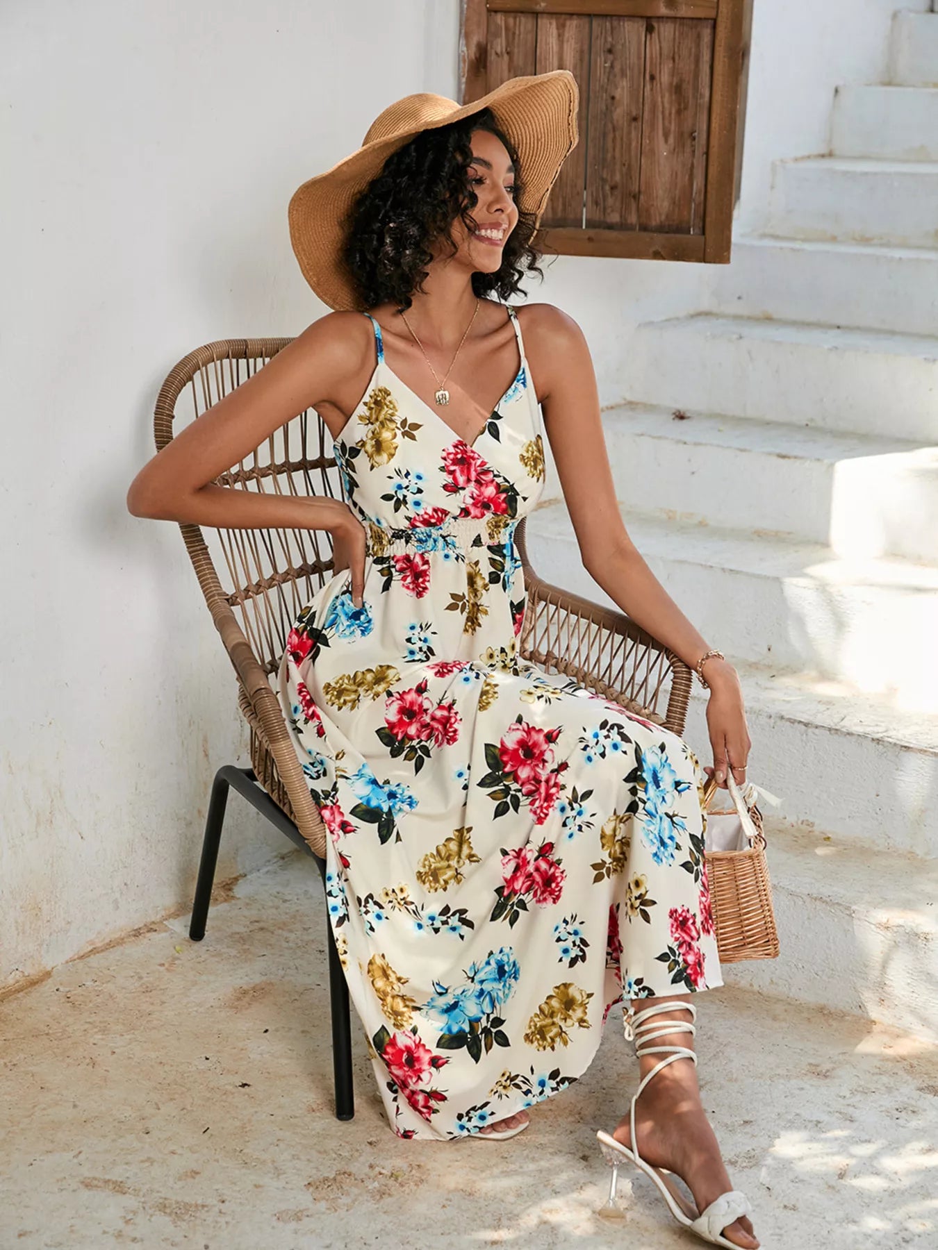 Spaghetti strap midi dress, cream base with red, blue, and yellow floral print