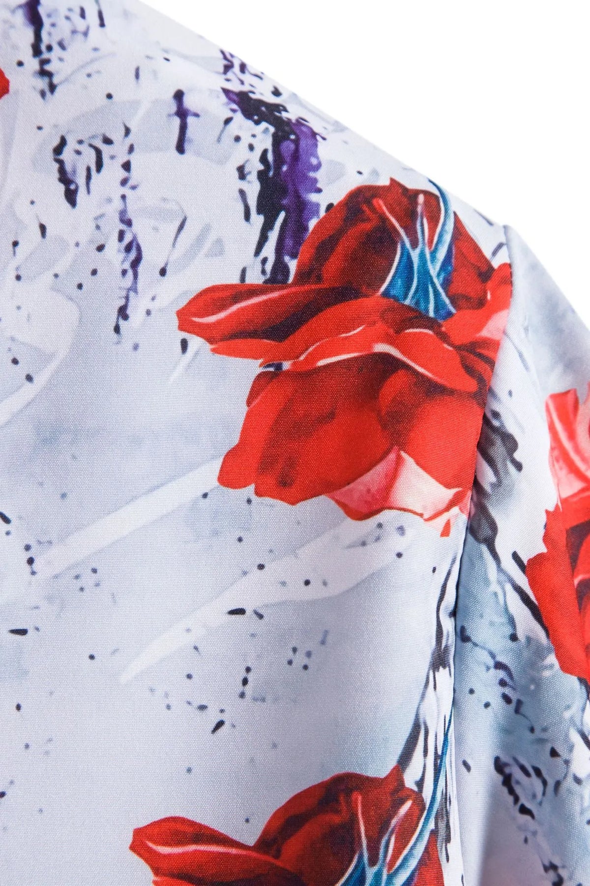 Floral button-up shirt fabric close-up, red rose with blue ink splatter