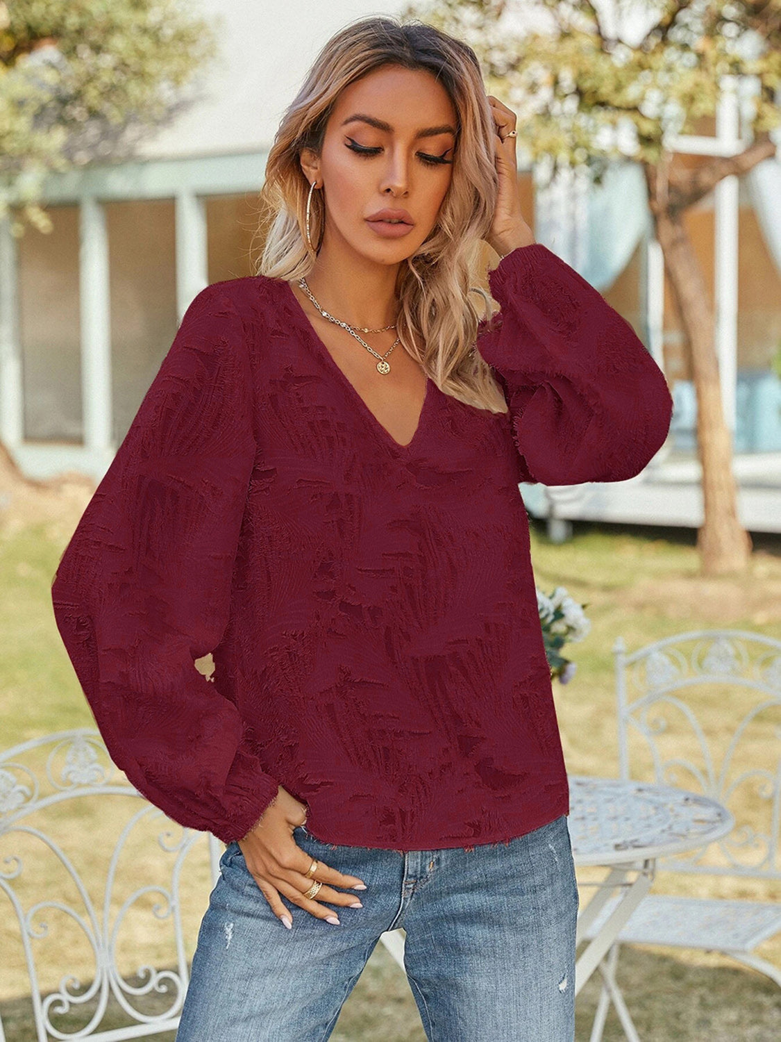 Burgundy V-neck long-sleeve blouse with puff sleeves and relaxed fit