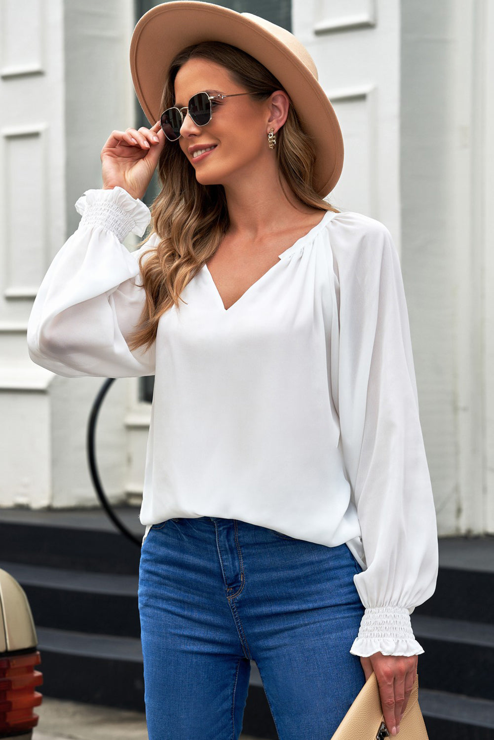 White lantern sleeve blouse with V-neck and puff sleeves with gathered cuffs