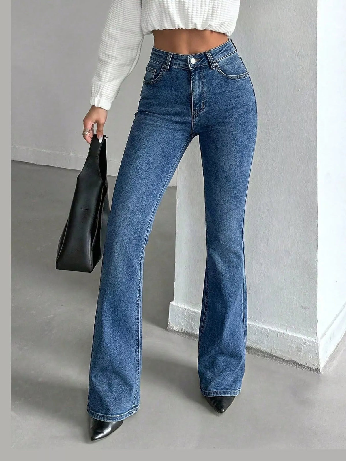 Washed high-waisted slim flare light blue denim jeans, front button and flared leg