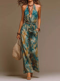 Green and teal tie-dye halter wide-leg jumpsuit with matching tie belt