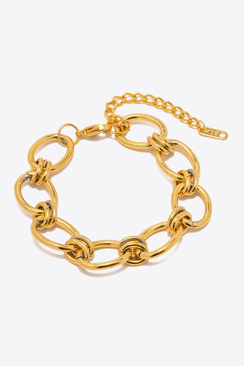 Gold chunky chain bracelet with interlocking oval links and bar toggle clasp