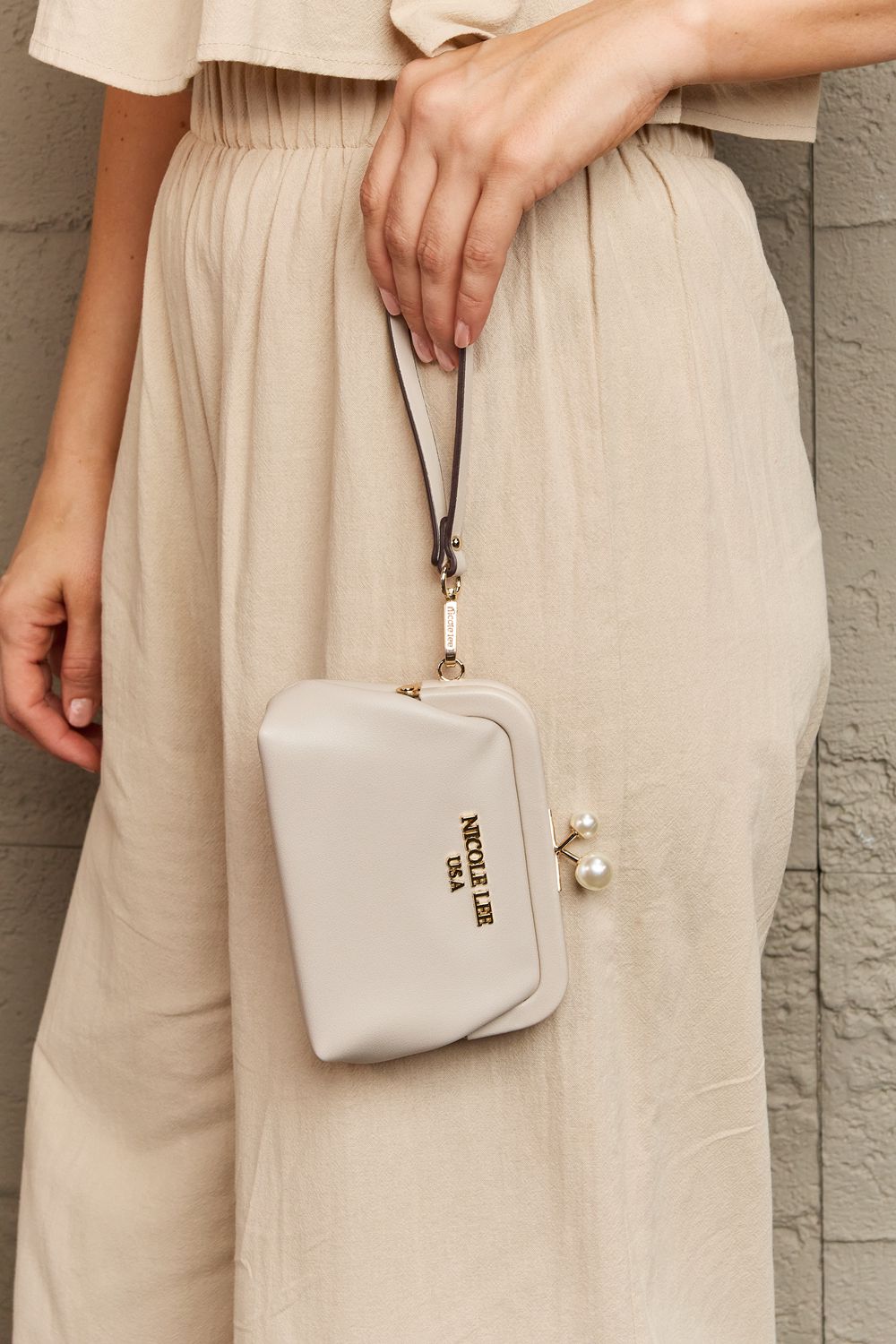 Nicole Lee USA Elise pearl coin purse, cream with pearl accent and hanging wrist strap