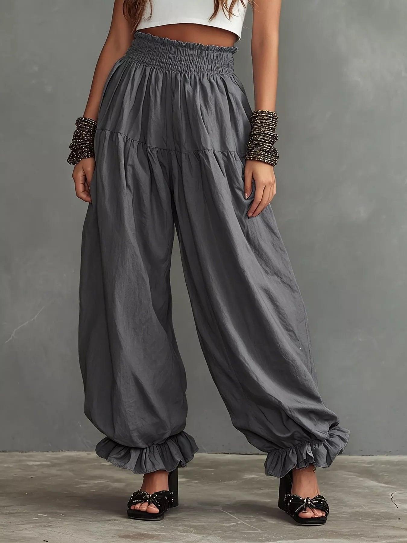 Dark gray smocked wide-leg pants with ruffle cuff hem