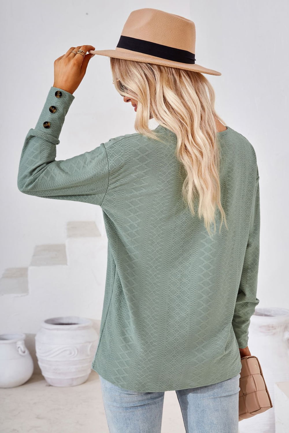 Sage green V-neck long-sleeve blouse, back view, textured diamond pattern